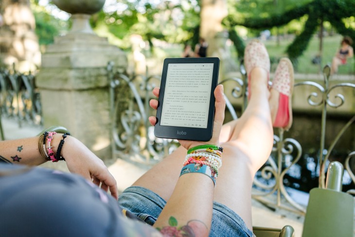 Woman reading ebook in garden